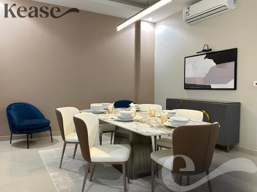 a dining room with a table and chairs at Kease Al-Mutamarat A-8 Timeless History GZ29 in Riyadh
