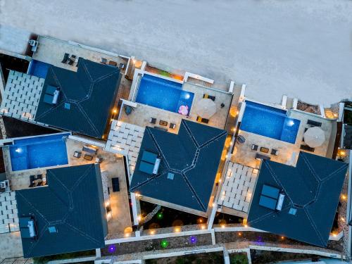 an aerial view of a building with blue roofs at Tashan Villas in Kas