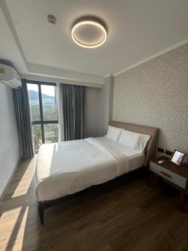 Ένα ή περισσότερα κρεβάτια σε δωμάτιο στο The One Chiang Mai Condo