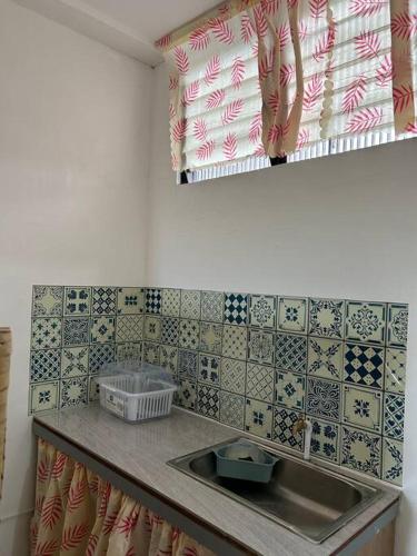 Kuchyň nebo kuchyňský kout v ubytování Caishen Apartelle 201