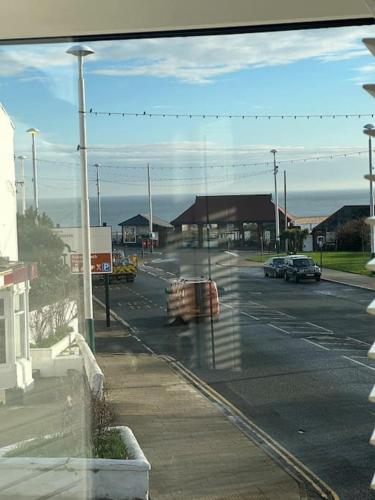 a view from a window of a street with cars at 2 bed sea view retreat in Monkwearmouth