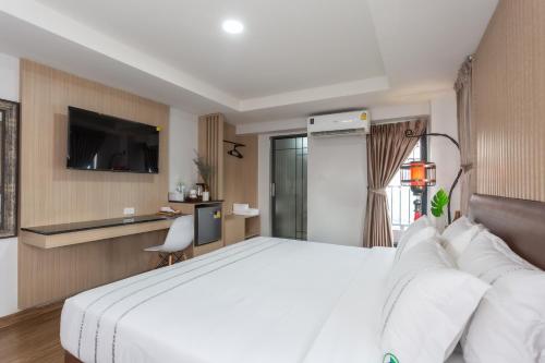 Postel nebo postele na pokoji v ubytování โรงแรมเซเว่นรัชดา S7VEN RATCHADA