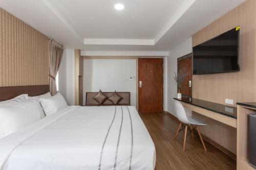 Postel nebo postele na pokoji v ubytování โรงแรมเซเว่นรัชดา S7VEN RATCHADA