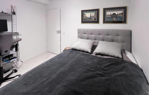 a bedroom with a large bed in a room at 2 Bedroom Cozy Apartment In Stockholm in Stockholm