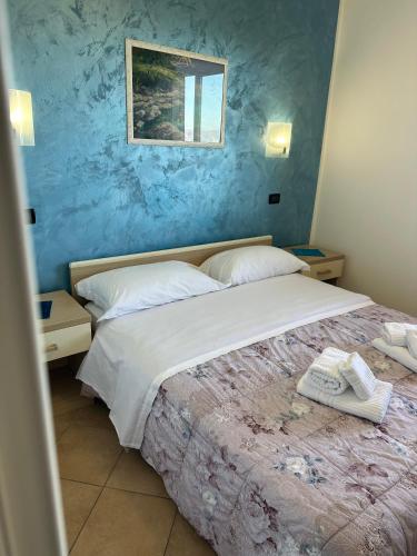 Ein Bett oder Betten in einem Zimmer der Unterkunft Scilla e Cariddi