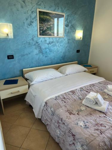 Ein Bett oder Betten in einem Zimmer der Unterkunft Scilla e Cariddi