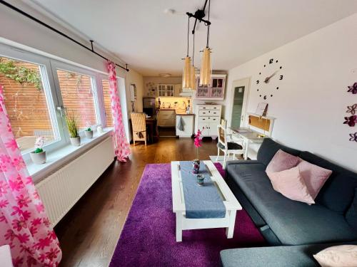 a living room with a couch and a table at Casparidyll in Sigmaringen