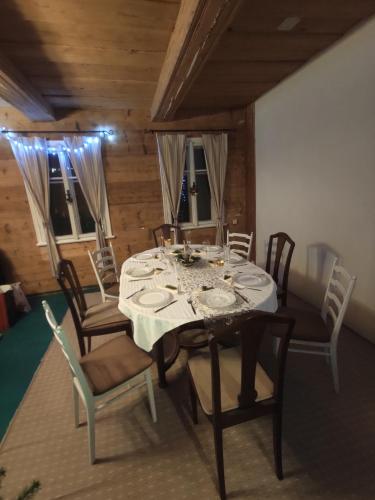 a dining room with a table and chairs at Alfapartmány in Krásná Lípa