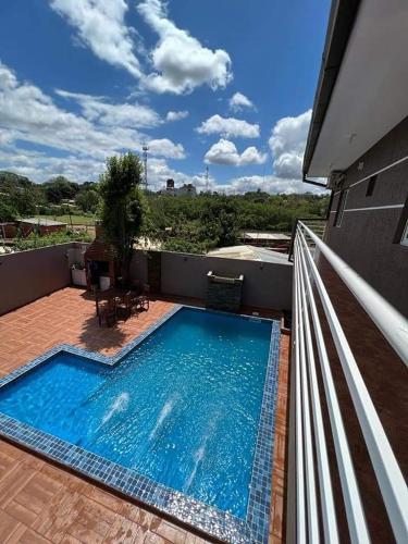 a swimming pool on the balcony of a house at Don machado in Puerto Iguazú