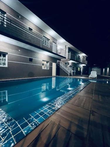 a large swimming pool at night in a building at Don machado in Puerto Iguazú