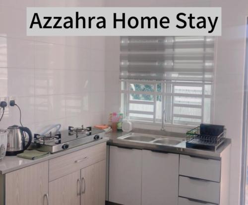 a kitchen with aania homestay written on a picture of a kitchen at Az-zahra Home Stay Kulim Hi-Tech in Kulim