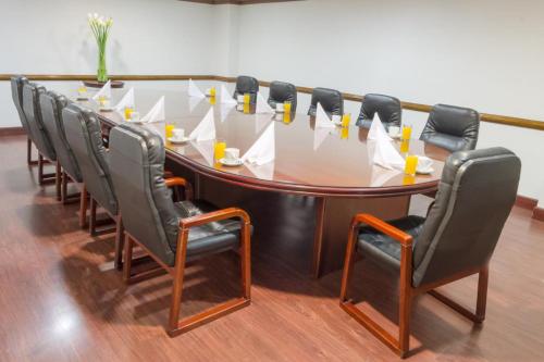 a conference room with a large table and chairs at Hotel Bogotá Regency Usaquén in Bogotá