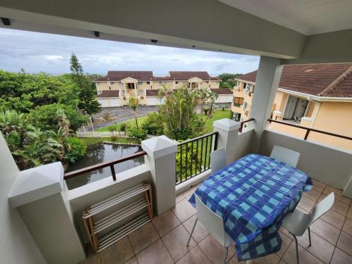 a balcony with a table and a view at SurfBay Sands 65 in Shelly Beach