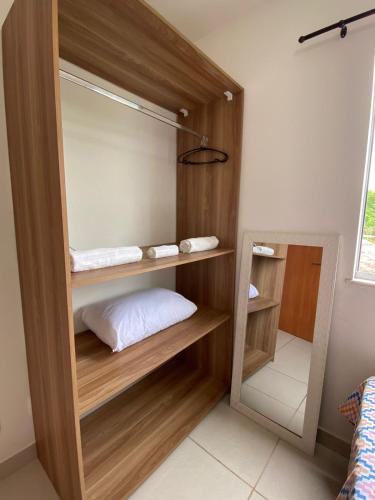 Ένα ή περισσότερα κρεβάτια σε δωμάτιο στο Apartamento em Ilhéus próximo as Praias