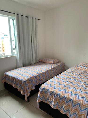 Ένα ή περισσότερα κρεβάτια σε δωμάτιο στο Apartamento em Ilhéus próximo as Praias