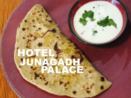 een bord met een tortilla en een kom dip bij junagadh places in Ujjain