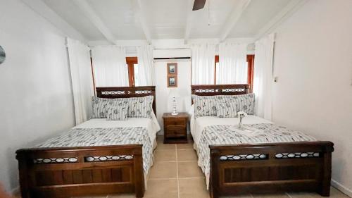 Postel nebo postele na pokoji v ubytování Villa Maud