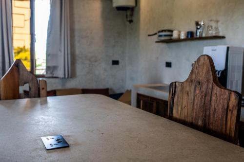 a remote control sitting on top of a table at Baobab Bungalows in Jambiani