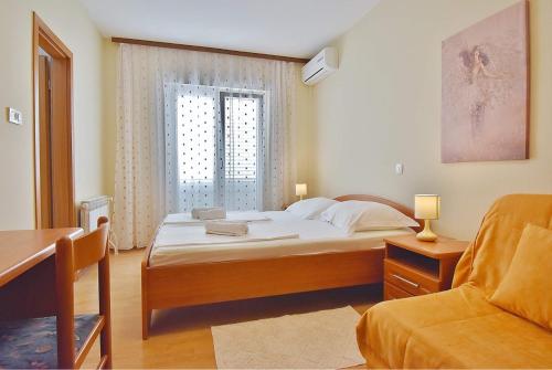 Postel nebo postele na pokoji v ubytování Guest House Sandra