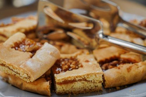 a plate of food with bread and nuts on it at Masseria dei Monaci in Otranto