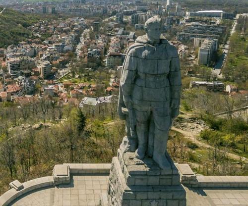 a statue of a man standing on top of a hill at Plovdiv center apartments 7 in Plovdiv
