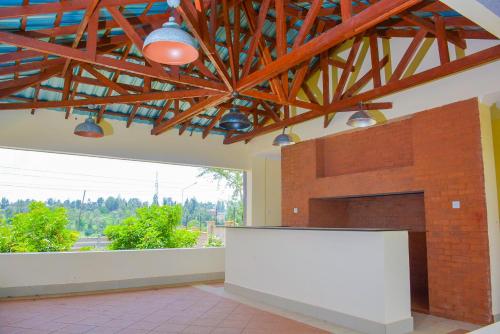 a large room with a white counter and a large window at House of DC- stylish 2 bedroom apartment in Kahawa