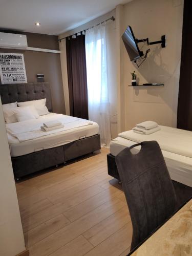 Ένα ή περισσότερα κρεβάτια σε δωμάτιο στο Hotel Franken an der Messe