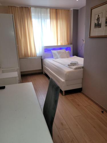 Ένα ή περισσότερα κρεβάτια σε δωμάτιο στο Hotel Franken an der Messe