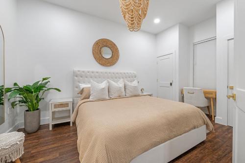 a bedroom with a bed and a mirror on the wall at 30A Villages of South Walton B190 - FREE BICYCLES - PRIVATE BEACH ACCESS in Seacrest