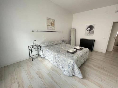 a bedroom with a bed and a table in it at Yaya's House - Venice in Mestre