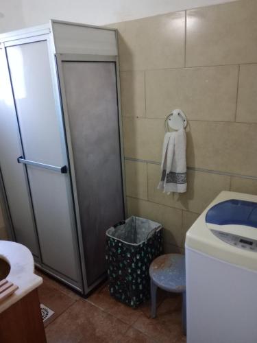 a bathroom with a shower and a toilet and a sink at Casa Bruniel in Montevideo