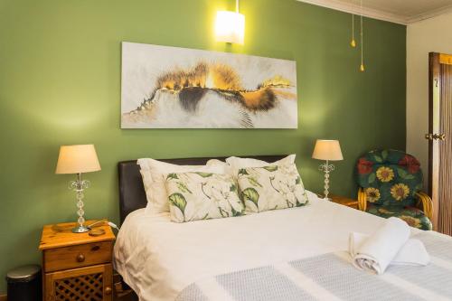 Postel nebo postele na pokoji v ubytování Rozendal Guest House