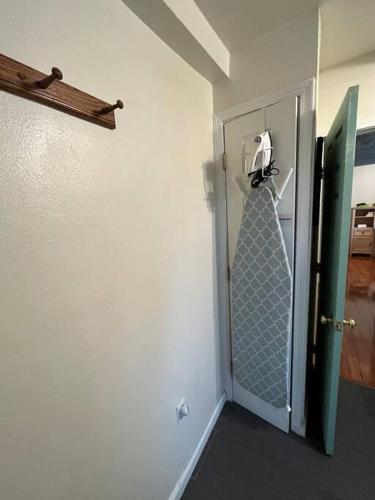 a room with a door with a tie hanging from it at Family Friendly Home in Seaside