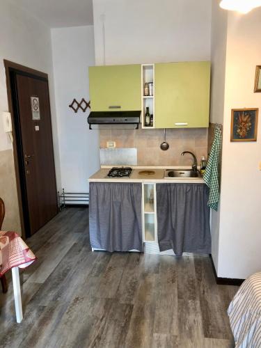 a kitchen with a sink and a counter top at Appartamento Verona in Verona