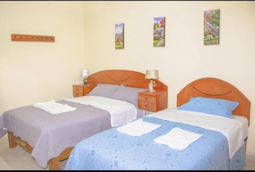 Ένα ή περισσότερα κρεβάτια σε δωμάτιο στο Dominius Hotel