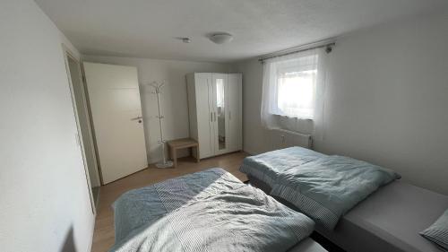 Ένα ή περισσότερα κρεβάτια σε δωμάτιο στο Apartment Erbach-Ulm