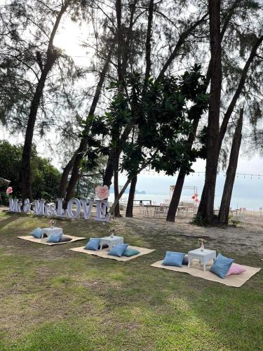 a row of yoga mats on the grass near the beach at Long Beach Club Krabi in Ao Nang Beach