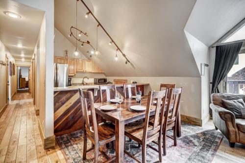 a kitchen and dining room with a wooden table and chairs at Unbelievable Location on Main Street - Walk Everywhere, Private Hot Tub! DOG FRIENDLY SCC4 in Breckenridge