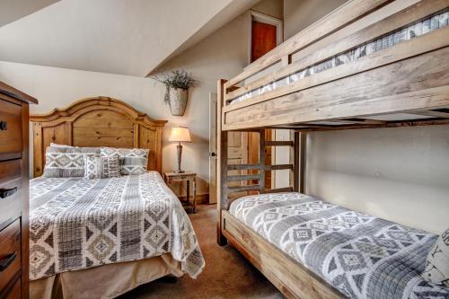 a bedroom with two bunk beds and a ladder at Unbelievable Location on Main Street - Walk Everywhere, Private Hot Tub! DOG FRIENDLY SCC4 in Breckenridge