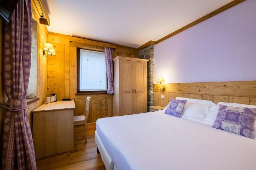 Mirtillo Alpino Casa Vacanzeにあるベッド