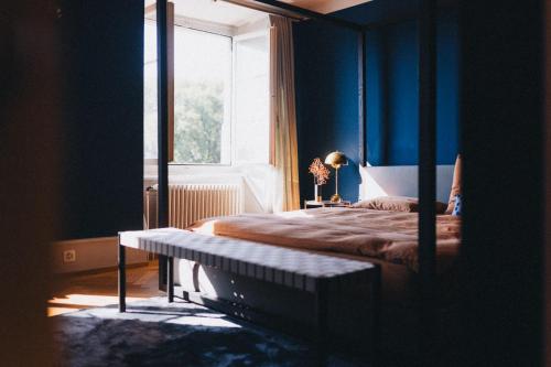 a bedroom with a bed and a window at IN2 BnB in Solothurn