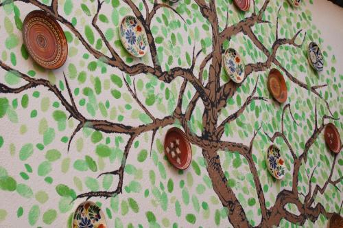 a cake with a tree painted on it at Art Hostel in Tashkent