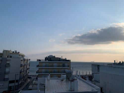 a view of the ocean from a building at Sunset Sea Apartment in Alexandroupoli