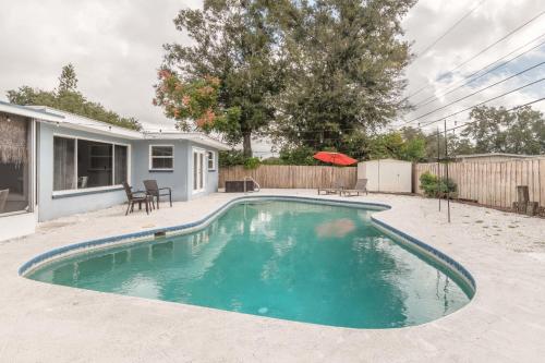 a swimming pool in the backyard of a house at Free Heated Pool 6 MI to Clearwater Beach in Clearwater