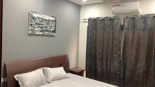 Ένα ή περισσότερα κρεβάτια σε δωμάτιο στο Aqua view Bijilo