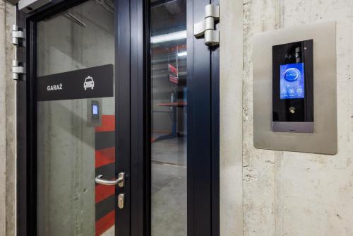 a door with a smart door sensor on it at Emihouse Riverside Apartments in Rzeszów