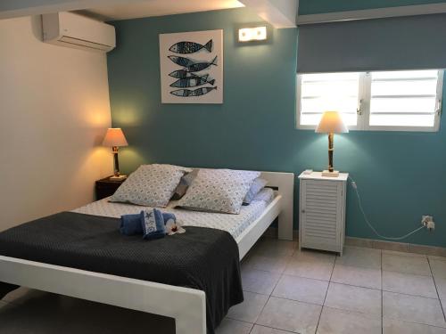 Postel nebo postele na pokoji v ubytování Appartement style Caribeen