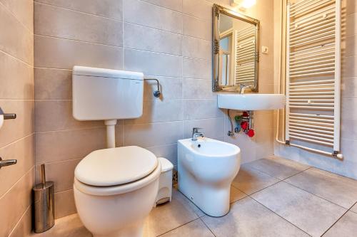 a bathroom with a toilet and a sink at Apartments Frlan in Kastav