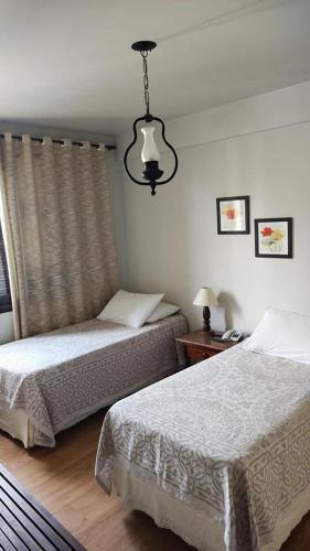Ένα ή περισσότερα κρεβάτια σε δωμάτιο στο Hotel São Luiz