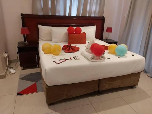 a bed with balloons on it in a room at Top Stay Inn in Kasane